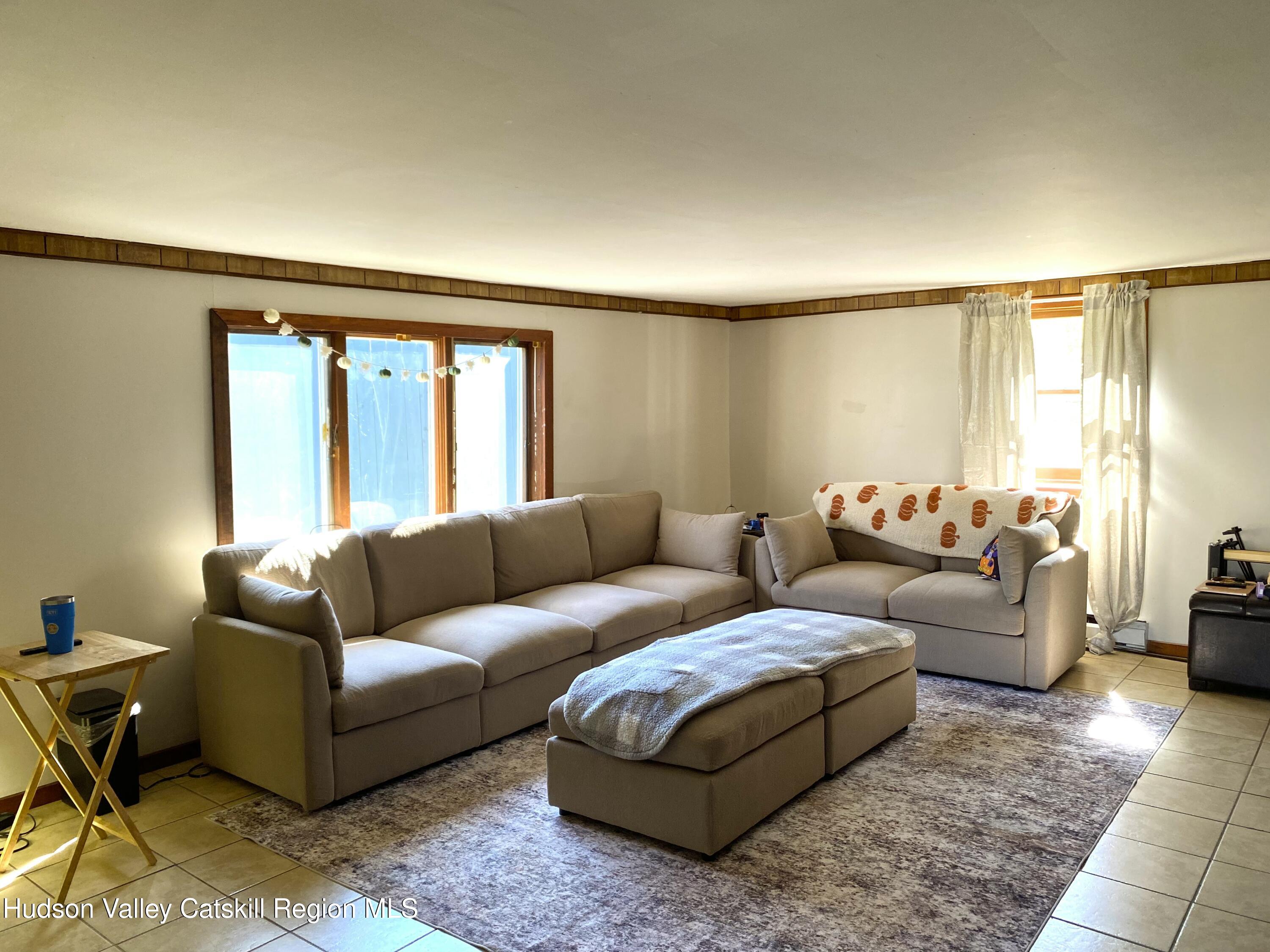 53654 Highway 30 Roxbury, NY 12474 - Photo 6 of 18 a living room with furniture and a window