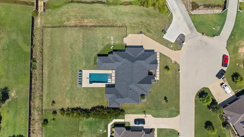 an aerial view of a house with outdoor space