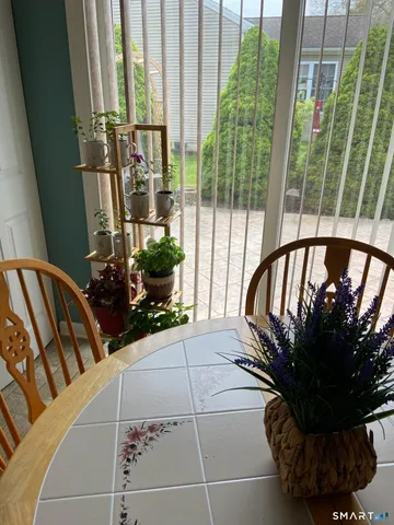 a view of a balcony with chairs