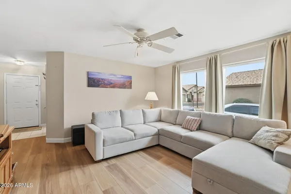 a living room with furniture and a large window