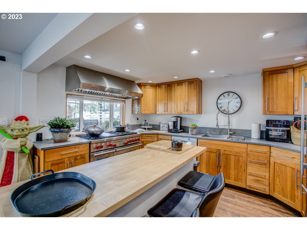 173 Northeast Bridgeton Road, Unit 24 Portland, OR 97211 - Photo 12 of 36 a kitchen with sink refrigerator and window