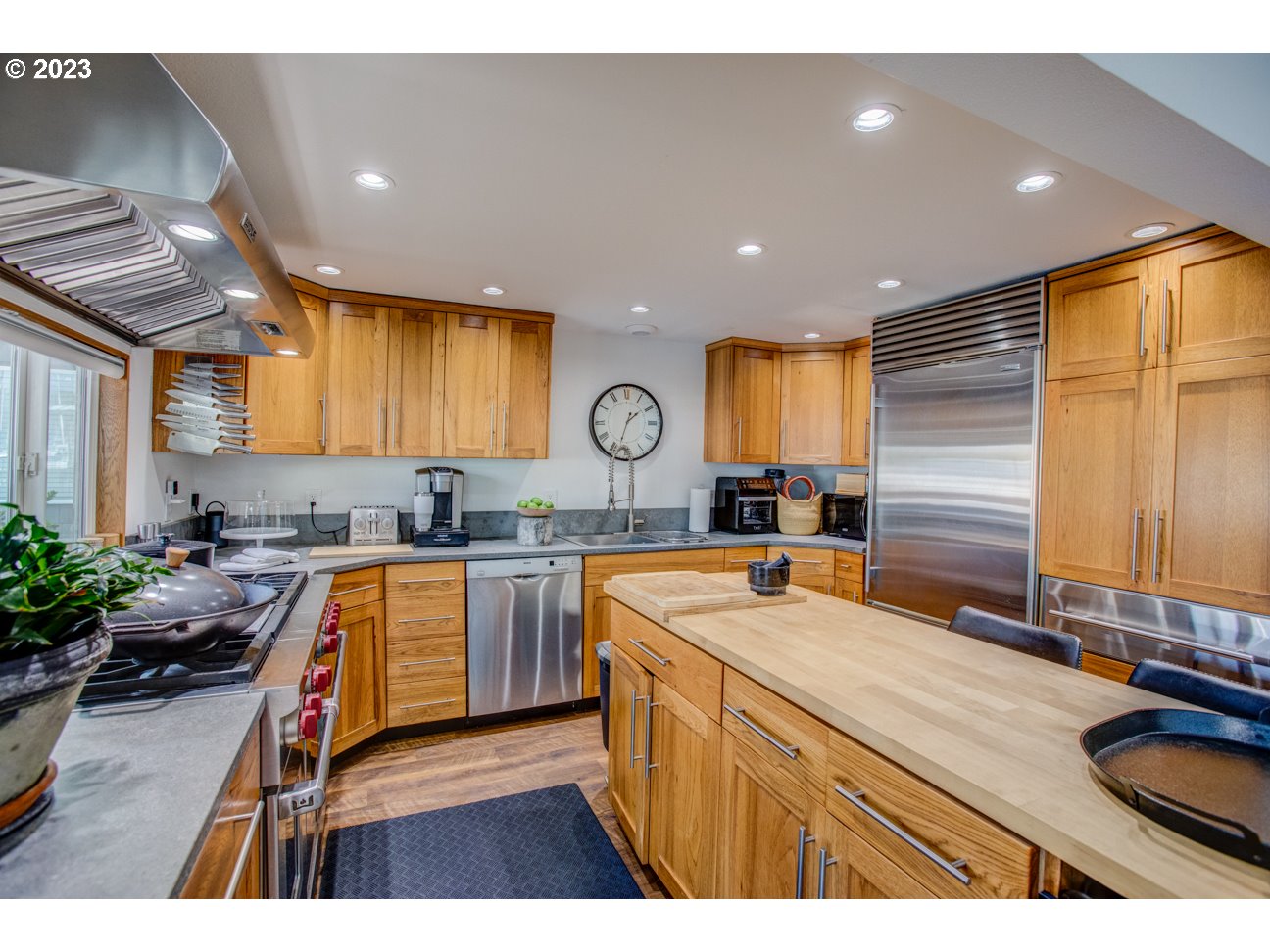 173 Northeast Bridgeton Road, Unit 24 Portland, OR 97211 - Photo 15 of 36 a kitchen with sink refrigerator and stove