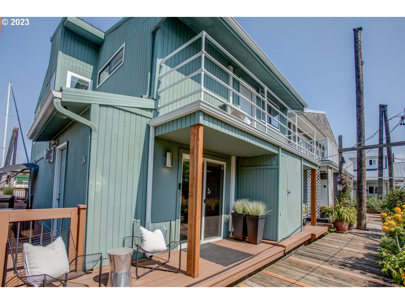 173 Northeast Bridgeton Road, Unit 24 Portland, OR 97211 - Photo 2 of 36 a view of a house with entrance gate
