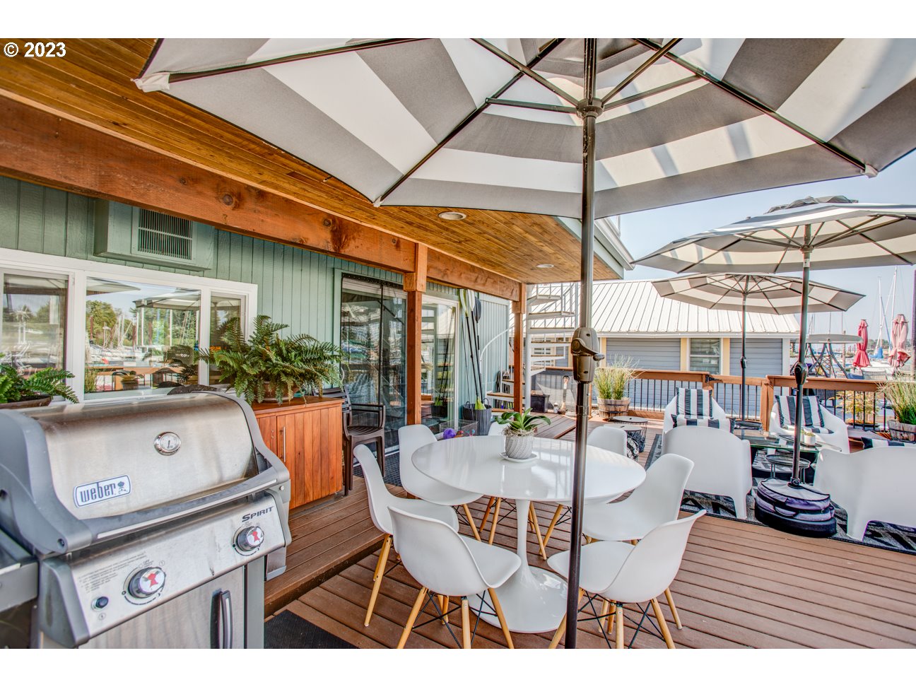 173 Northeast Bridgeton Road, Unit 24 Portland, OR 97211 - Photo 21 of 36 a outdoor space with chairs and umbrella
