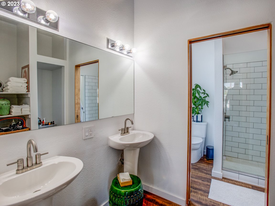 173 Northeast Bridgeton Road, Unit 24 Portland, OR 97211 - Photo 23 of 36 a bathroom with a sink and a mirror
