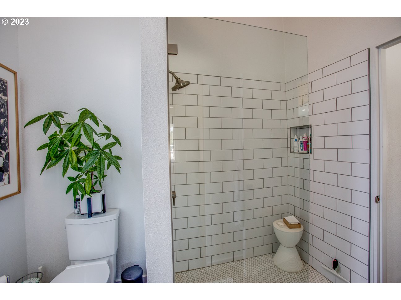 173 Northeast Bridgeton Road, Unit 24 Portland, OR 97211 - Photo 25 of 36 a bathroom with a toilet and a shower