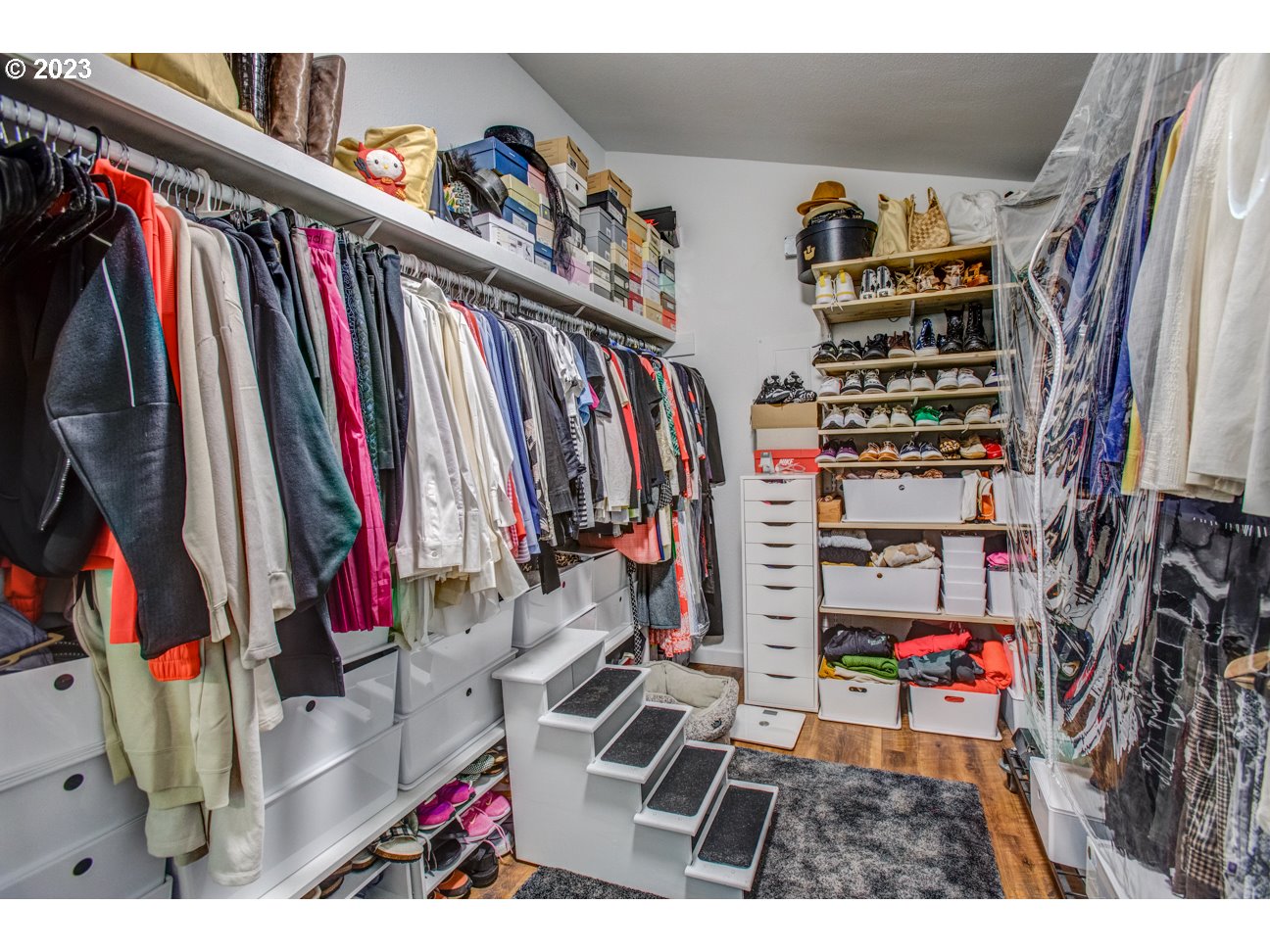 173 Northeast Bridgeton Road, Unit 24 Portland, OR 97211 - Photo 27 of 36 a view of walk in closet with clothes and shoes