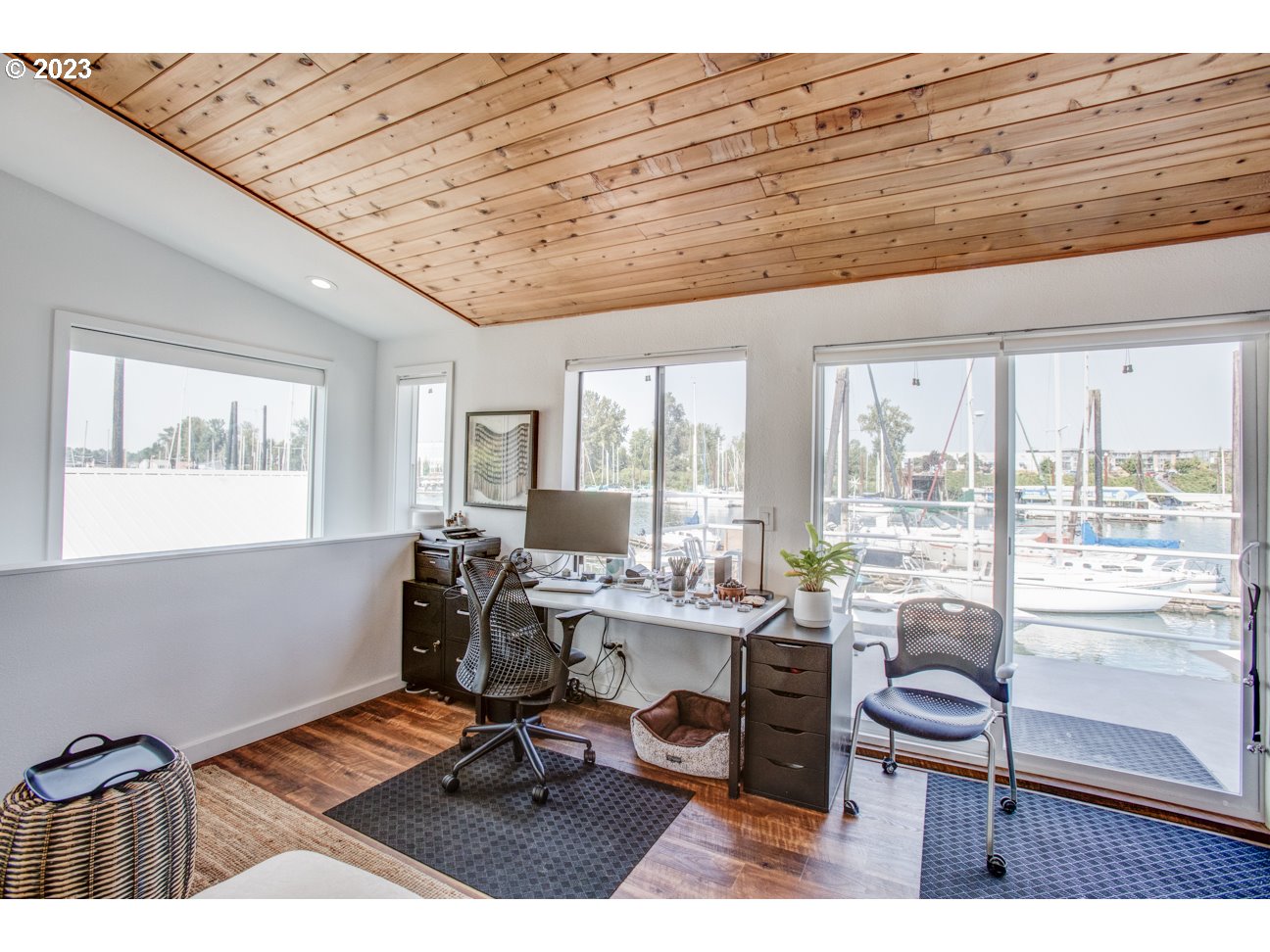 173 Northeast Bridgeton Road, Unit 24 Portland, OR 97211 - Photo 33 of 36 a work room with furniture and large windows