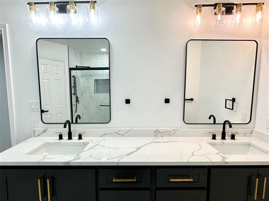 601 Short Street McKinney, TX 75069 - Photo 15 of 28 a bathroom with a double vanity sink and a mirror