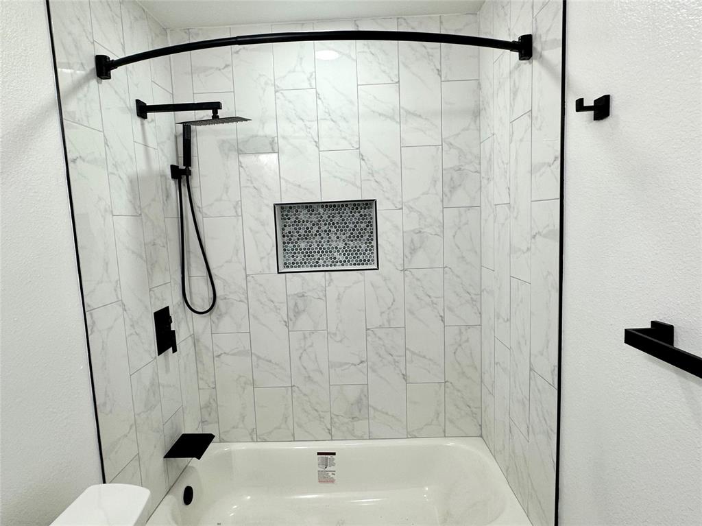 601 Short Street McKinney, TX 75069 - Photo 19 of 28 a bathroom with a shower and a sink