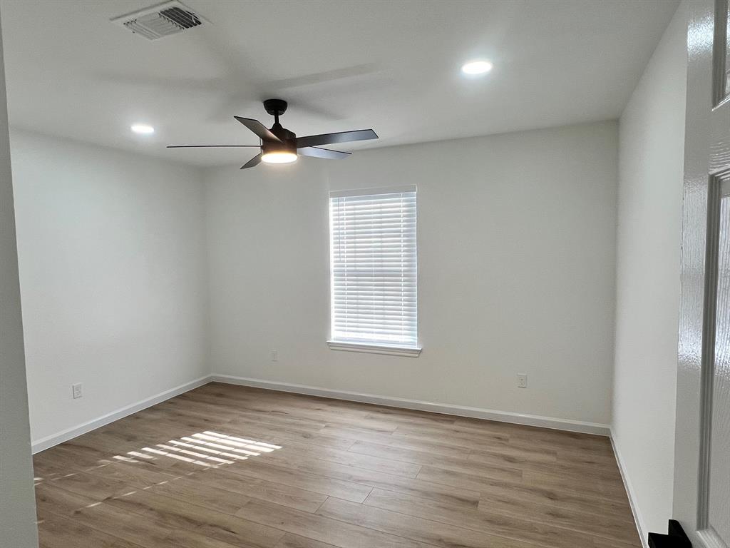 601 Short Street McKinney, TX 75069 - Photo 28 of 28 an empty room with a window and ceiling fan