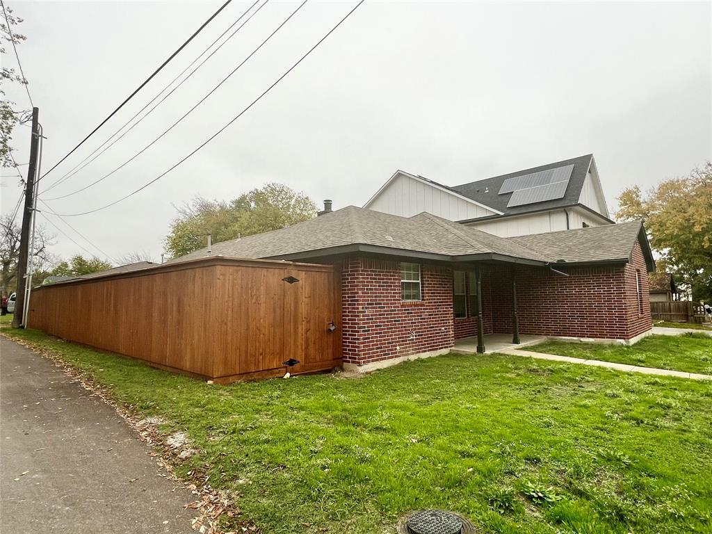 601 Short Street McKinney, TX 75069 - Photo 5 of 28 a view of a backyard with potted plants and large tree