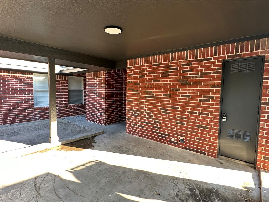 601 Short Street McKinney, TX 75069 - Photo 6 of 28 a view of a porch with a table and chairs