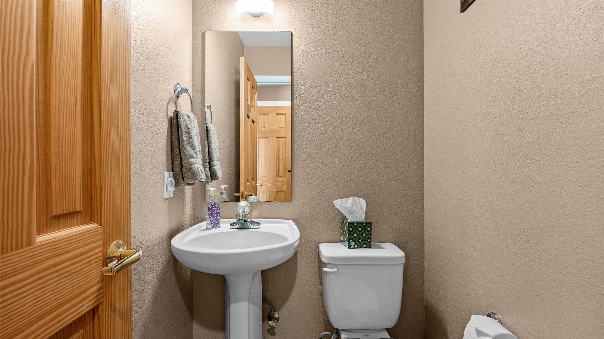 2344 1/2 Rattlesnake Court Grand Junction, CO 81507 - Photo 11 of 36 a bathroom with a toilet sink and mirror