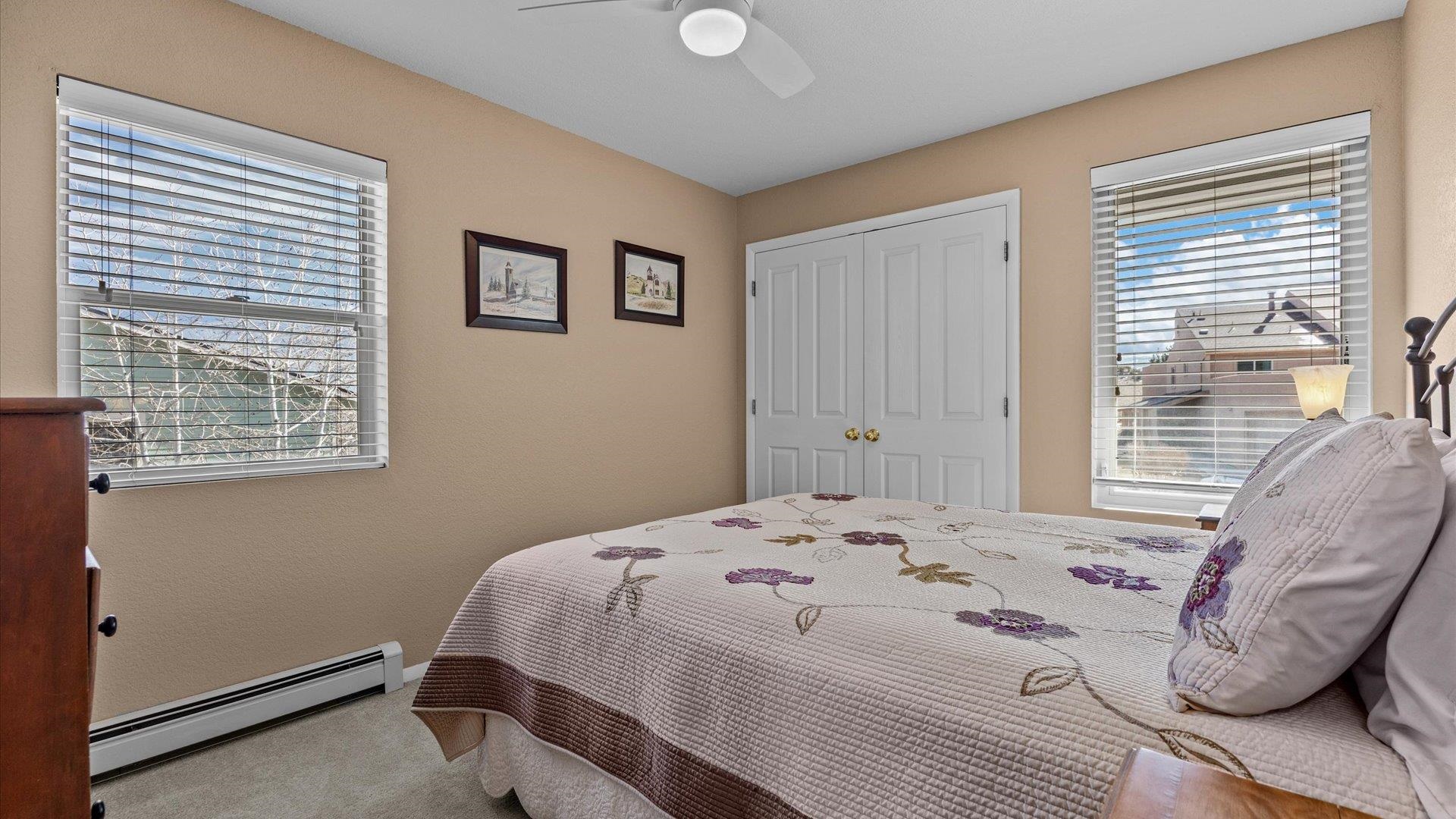 2344 1/2 Rattlesnake Court Grand Junction, CO 81507 - Photo 17 of 36 a bedroom with a bed and a window