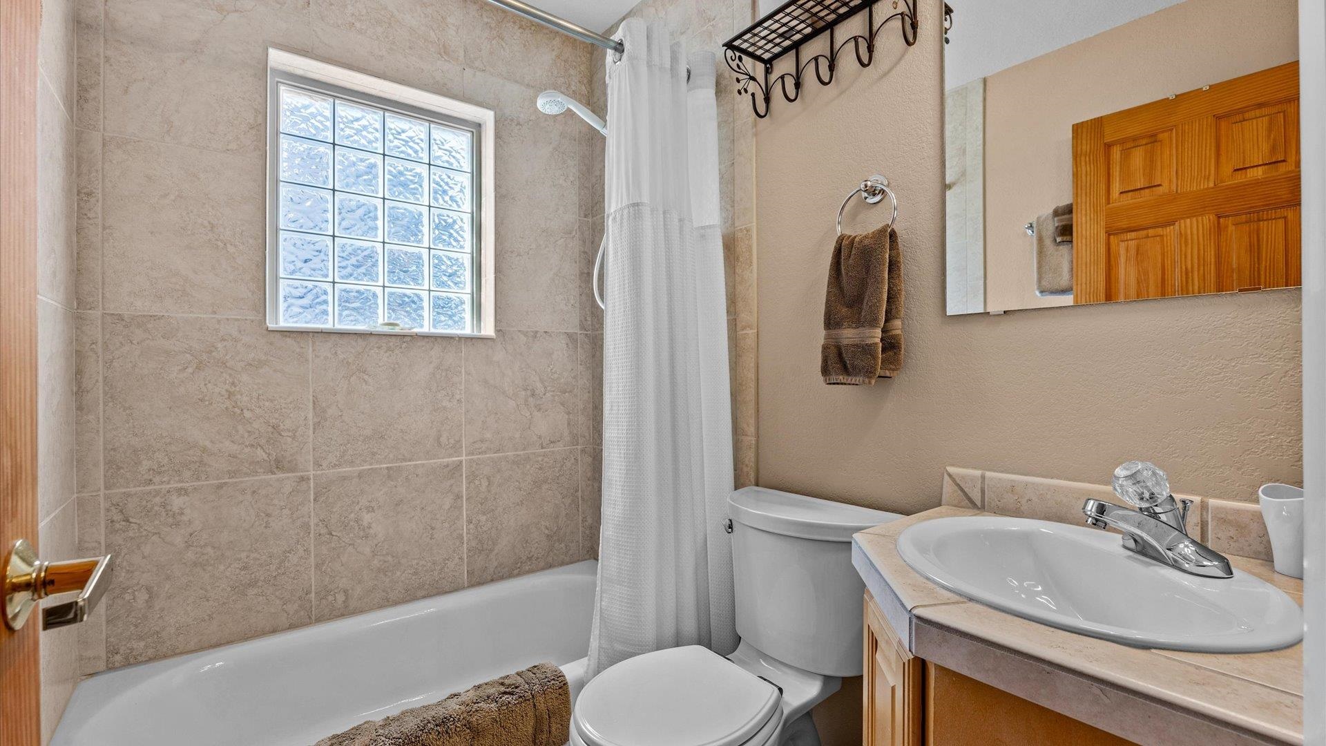 2344 1/2 Rattlesnake Court Grand Junction, CO 81507 - Photo 18 of 36 a bathroom with a sink toilet and shower