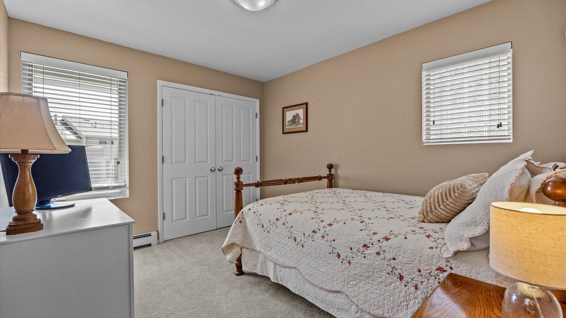 2344 1/2 Rattlesnake Court Grand Junction, CO 81507 - Photo 19 of 36 a bedroom with a bed and a window