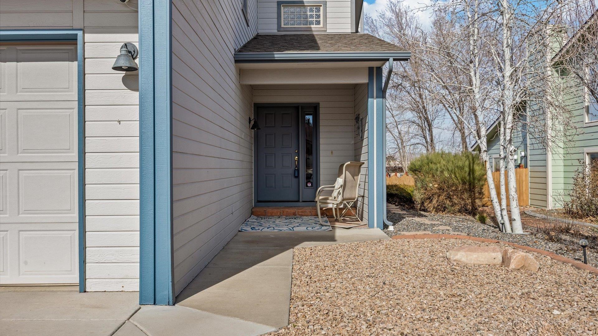 2344 1/2 Rattlesnake Court Grand Junction, CO 81507 - Photo 2 of 36 a front view of a house with garden