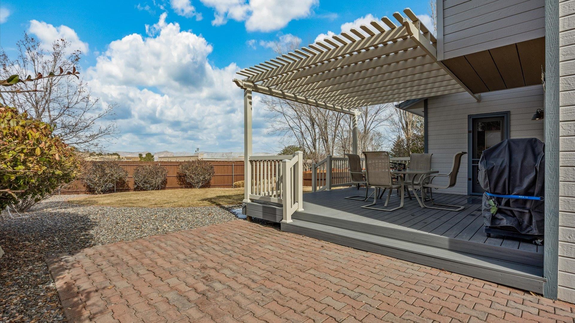 2344 1/2 Rattlesnake Court Grand Junction, CO 81507 - Photo 21 of 36 a patio with table and chairs
