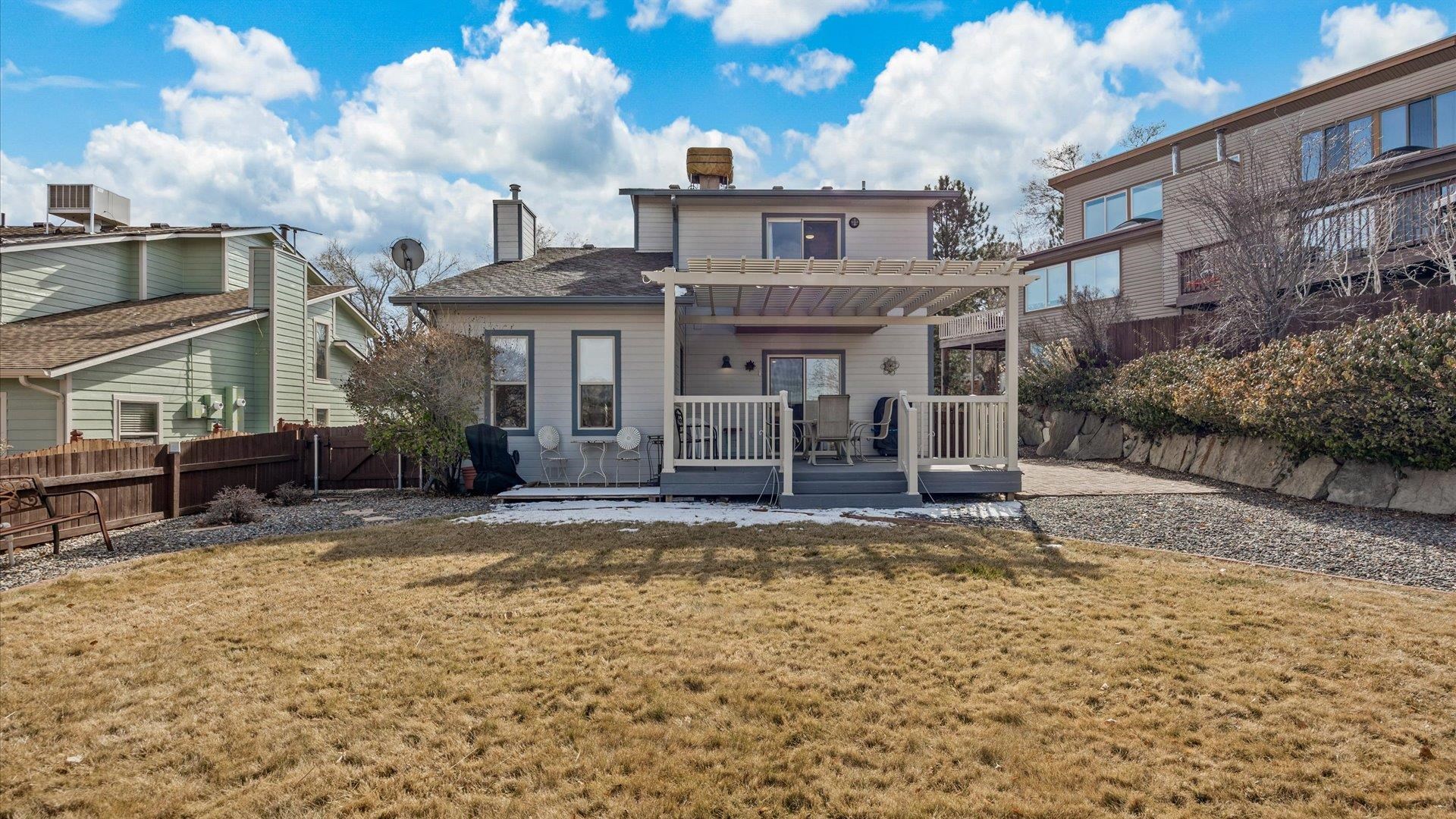 2344 1/2 Rattlesnake Court Grand Junction, CO 81507 - Photo 23 of 36 a view of a house with swimming pool and sitting area