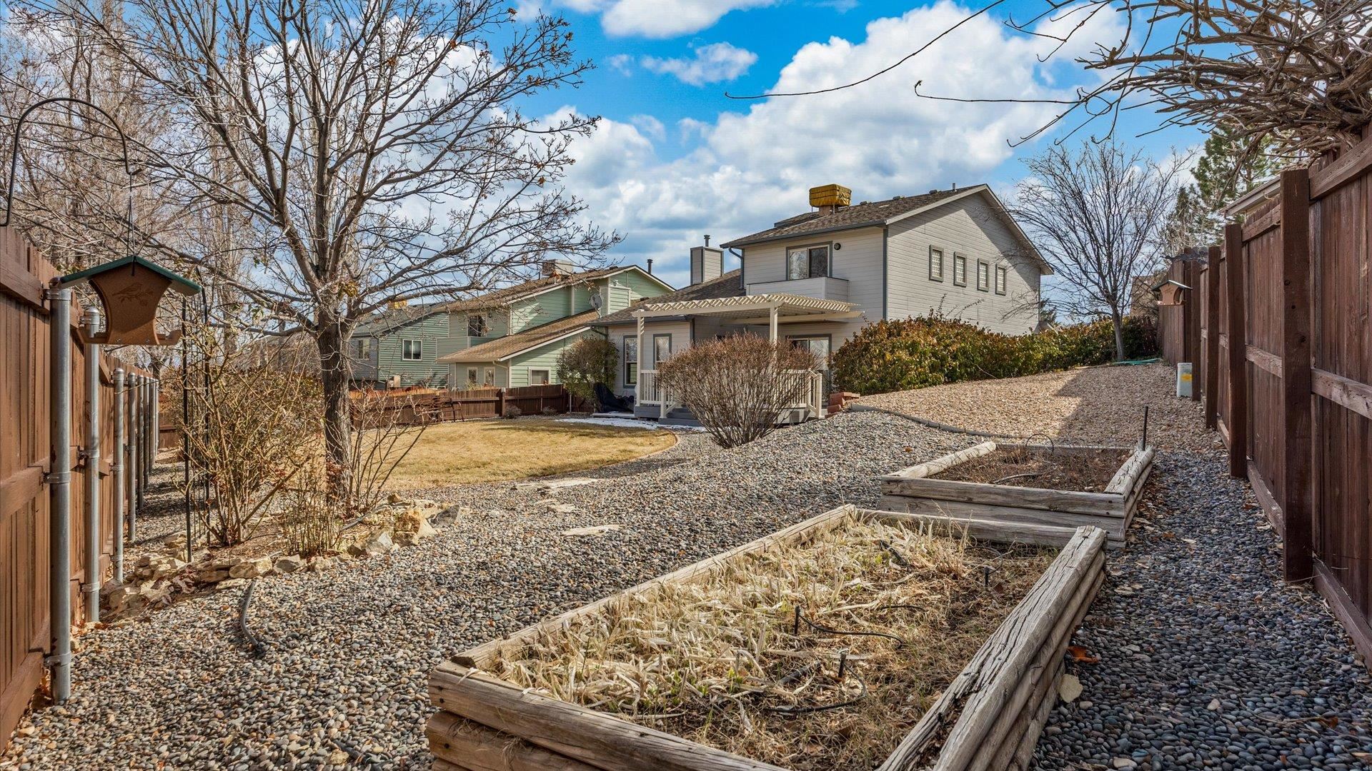 2344 1/2 Rattlesnake Court Grand Junction, CO 81507 - Photo 24 of 36 a view of yard with large tree