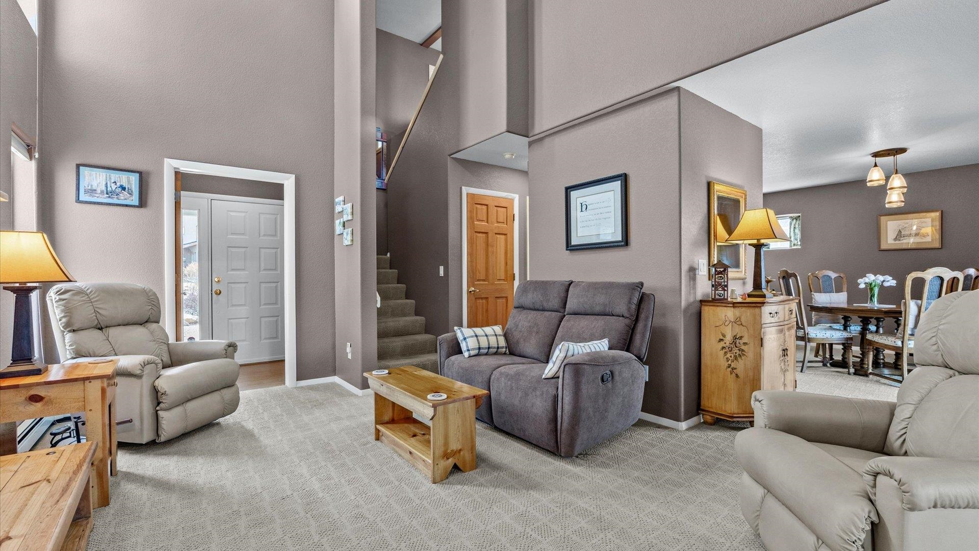 2344 1/2 Rattlesnake Court Grand Junction, CO 81507 - Photo 3 of 36 a living room with furniture and a lamp