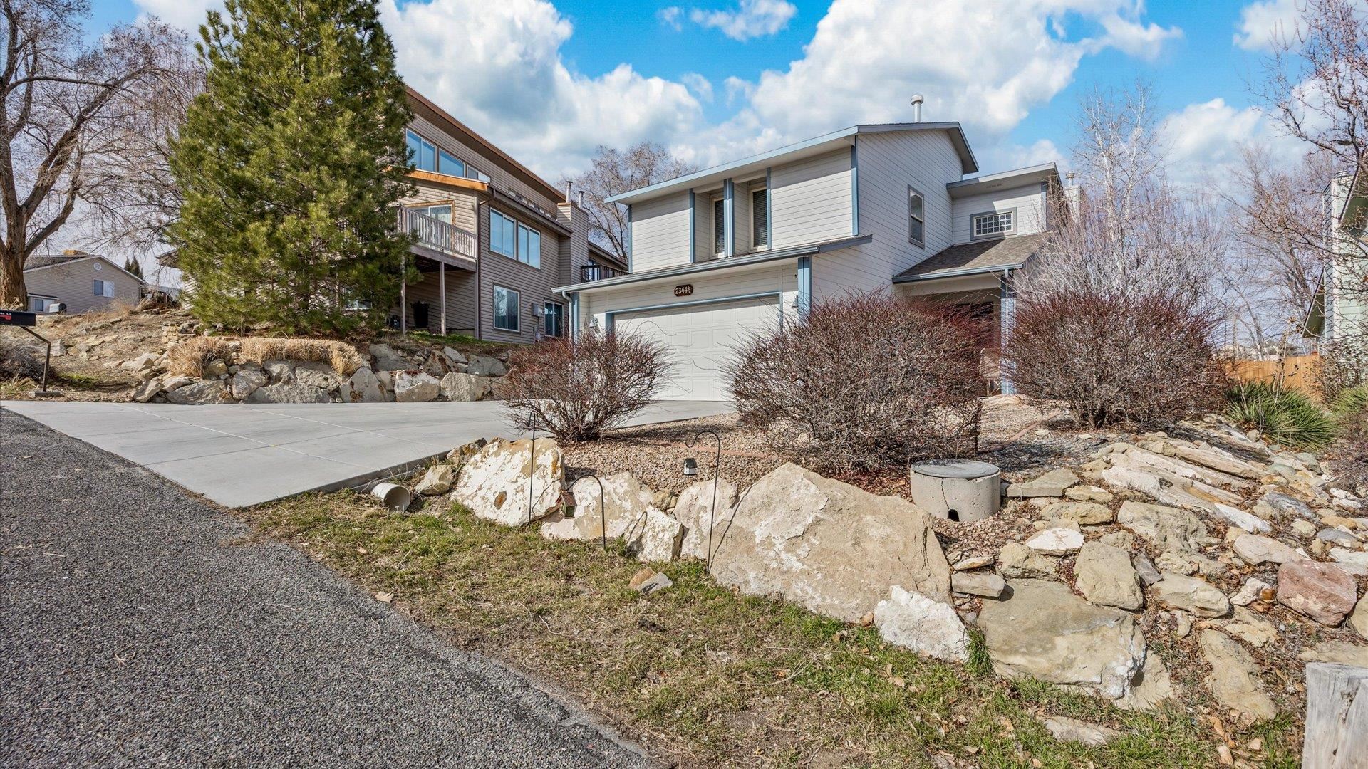 2344 1/2 Rattlesnake Court Grand Junction, CO 81507 - Photo 31 of 36 a view of a house with a yard