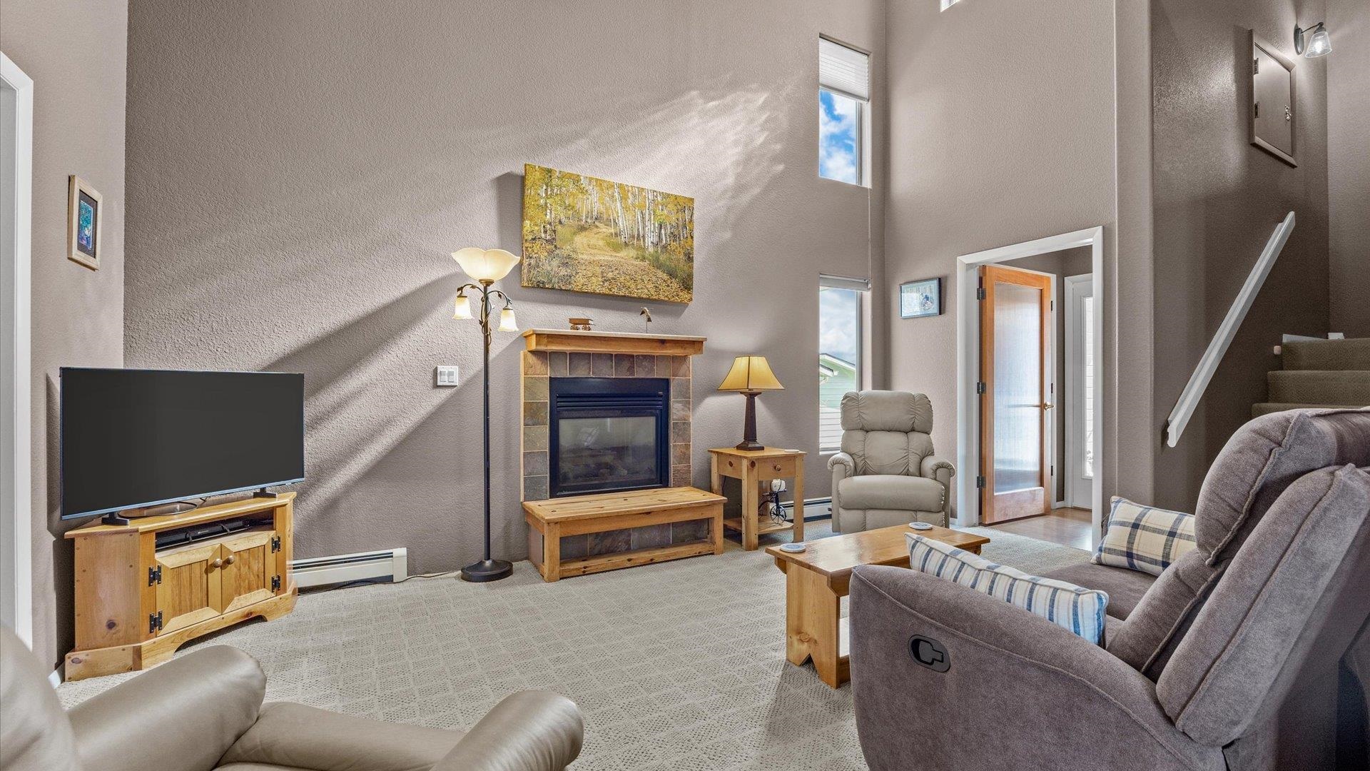 2344 1/2 Rattlesnake Court Grand Junction, CO 81507 - Photo 4 of 36 a living room with furniture and a flat screen tv