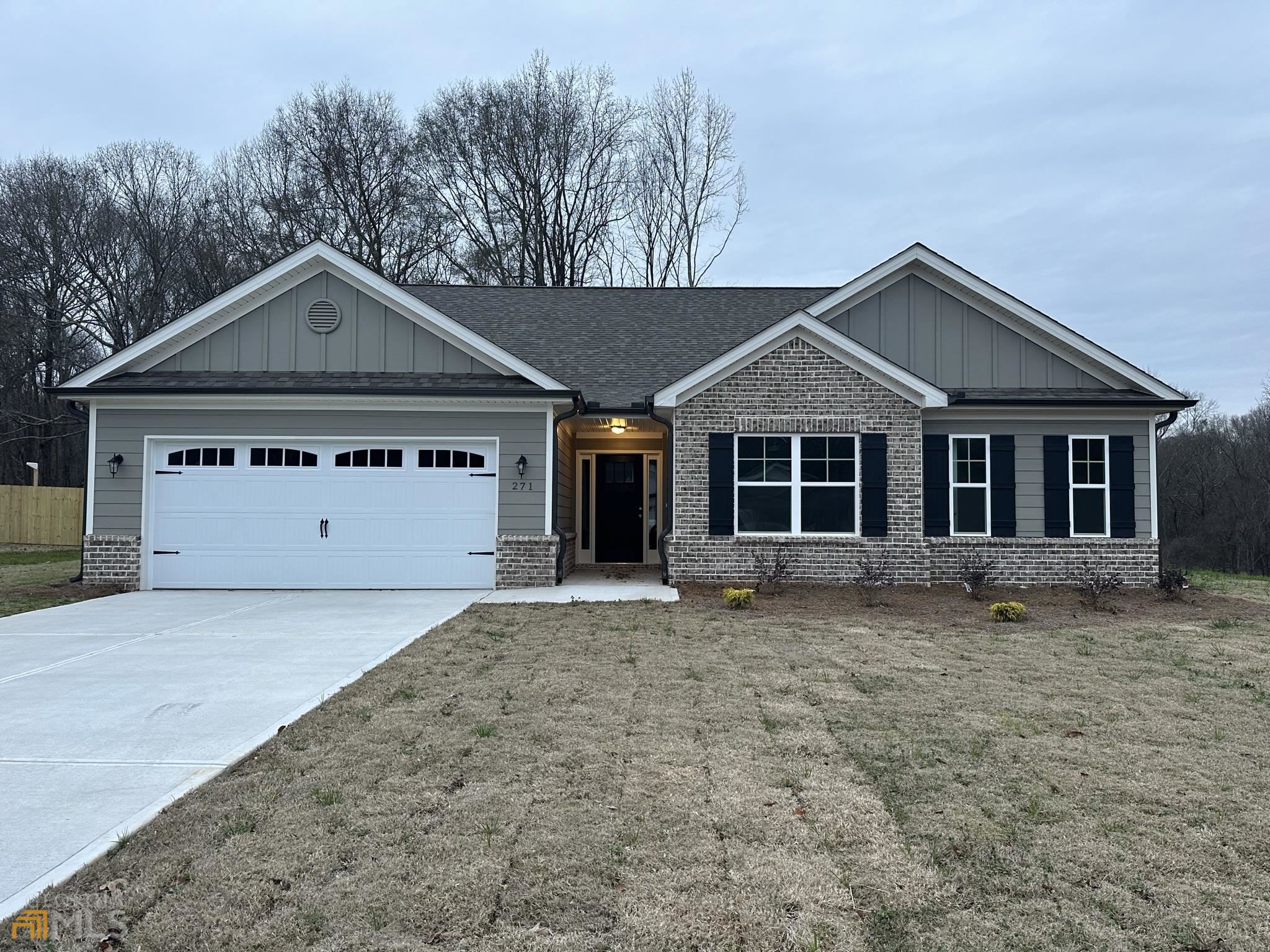 271 Finch Landing Road, Unit 22 Winder, GA 30680 - Photo 1 of 1 a front view of a house with a garden and yard