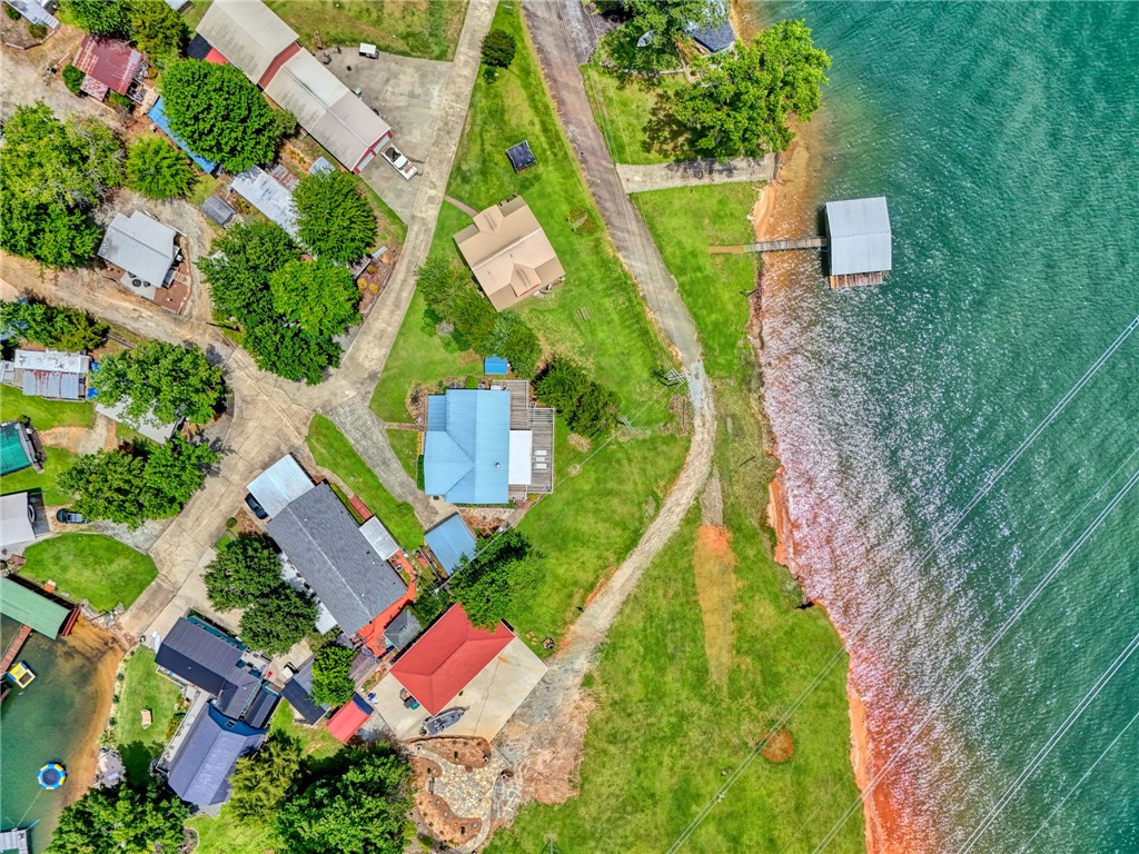 225 Nicholson Cove Road Seneca, SC 29672 - Photo 8 of 22 An aerial perspective reveals a vibrant waterfront community with private boat slips and lush green spaces.