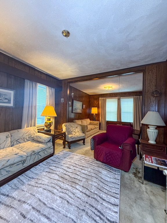 25 Clark Street Everett, MA 02149 - Photo 12 of 40 a bedroom with bed couch and window