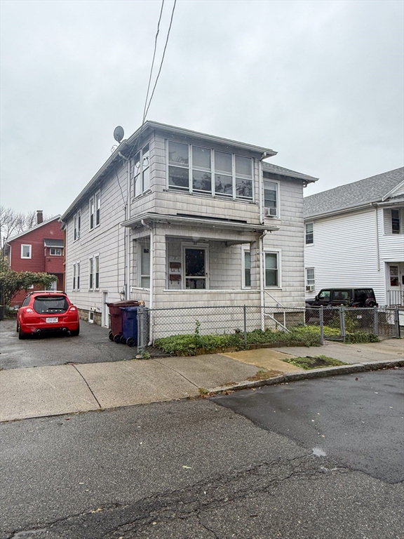 25 Clark Street Everett, MA 02149 - Photo 3 of 40 a view of a car park in front of house