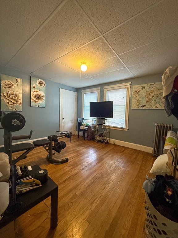 25 Clark Street Everett, MA 02149 - Photo 31 of 40 a room with furniture and a flat screen tv