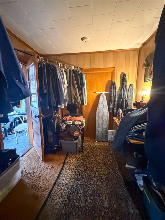 25 Clark Street Everett, MA 02149 - Photo 35 of 40 a view of walk in closet with clothes and shoes