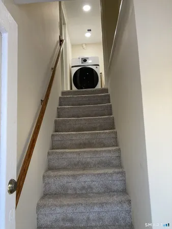 a utility room with washing machine