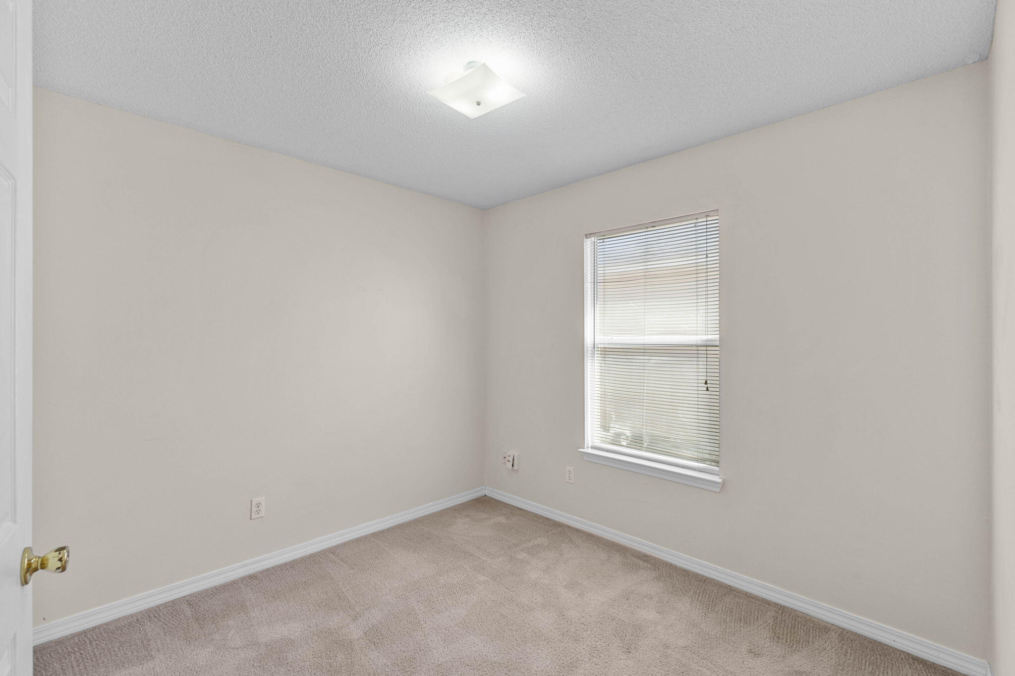 7612 Chablis Circle Navarre, FL 32566 - Photo 18 of 28 an empty room with a window