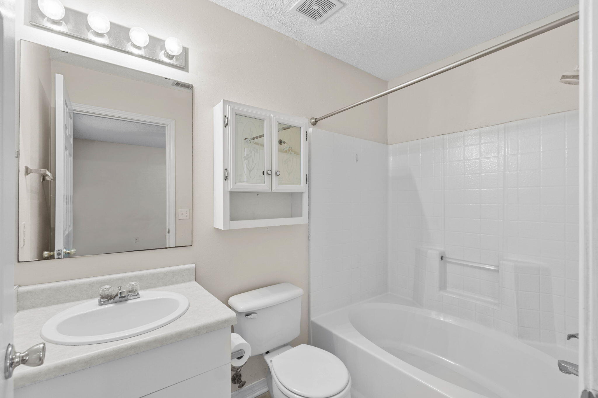 7612 Chablis Circle Navarre, FL 32566 - Photo 25 of 28 a bathroom with a sink toilet and shower