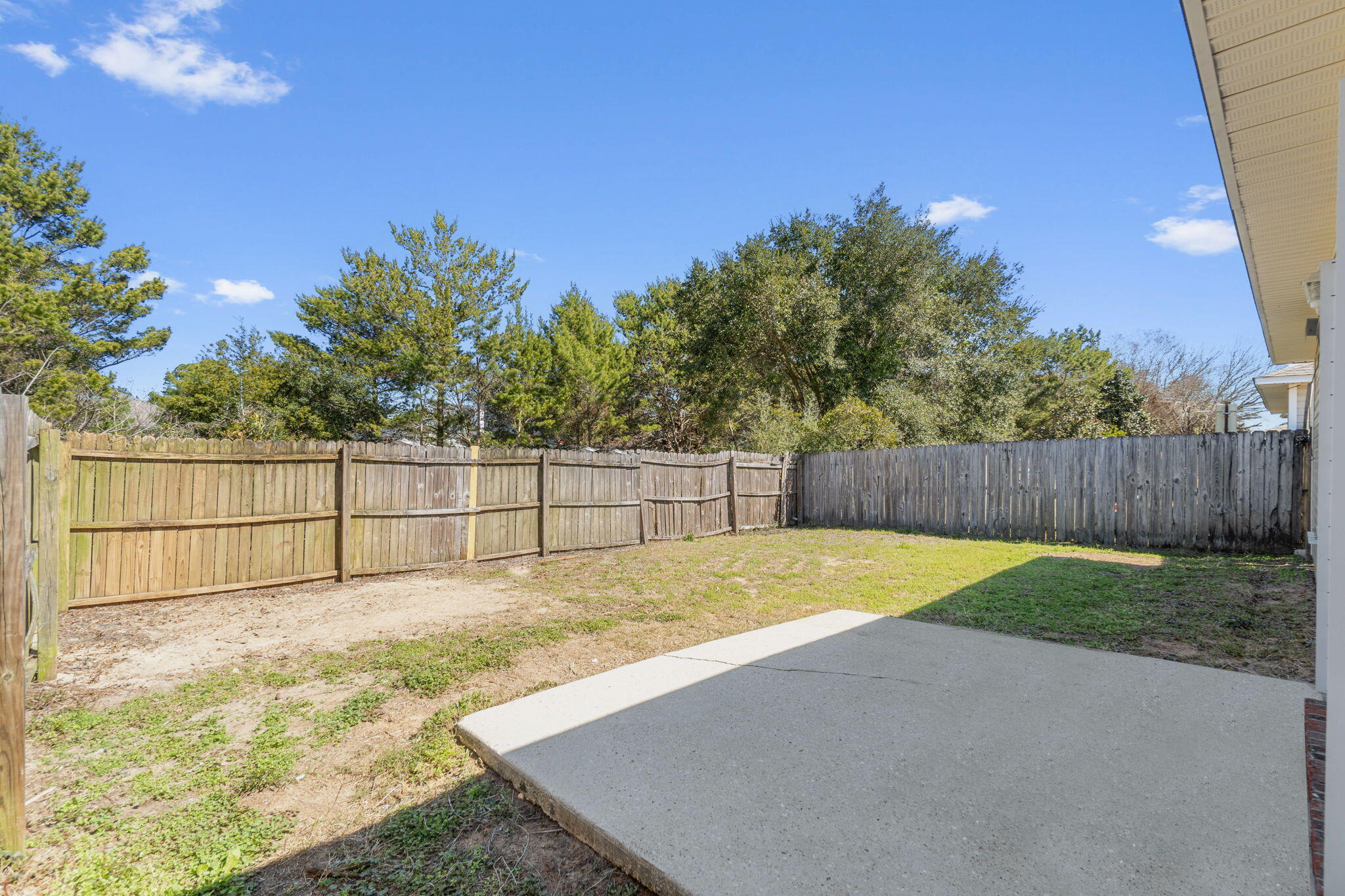 7612 Chablis Circle Navarre, FL 32566 - Photo 27 of 28 a view of backyard with wooden fence