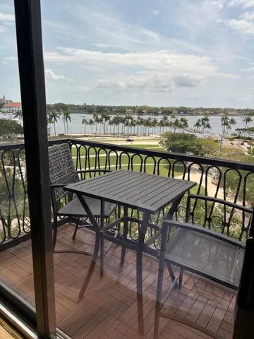 a view of swimming pool from a balcony