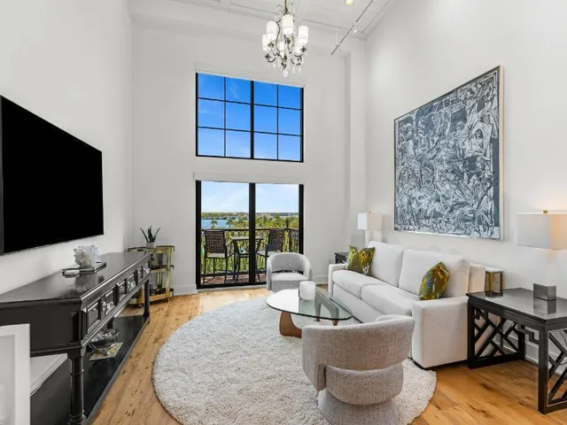 a living room with fireplace furniture and a flat screen tv