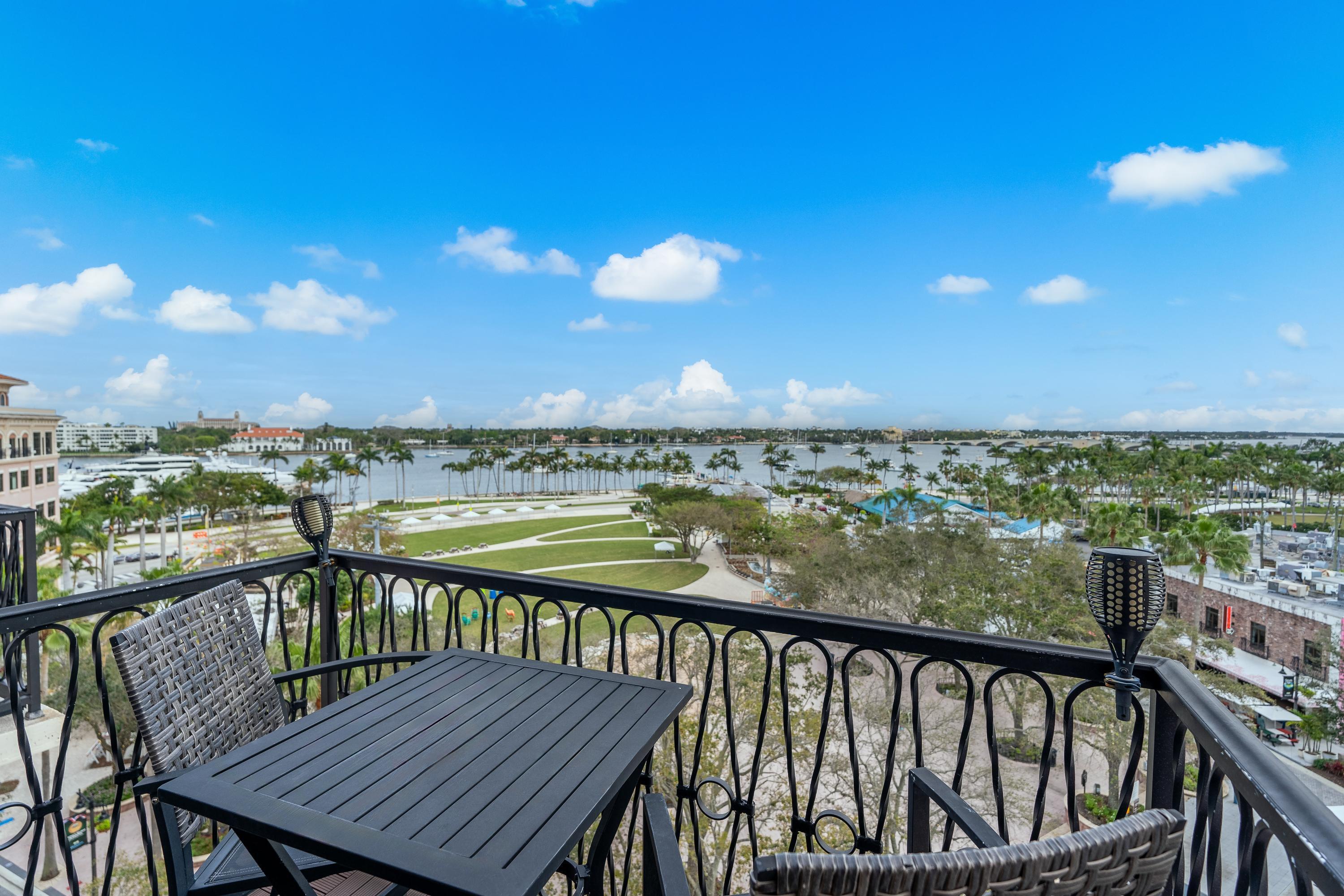 101 North Clematis Street, Unit 512 West Palm Beach, FL 33401 - Photo 5 of 17 a view of a balcony with wooden floor and lake view