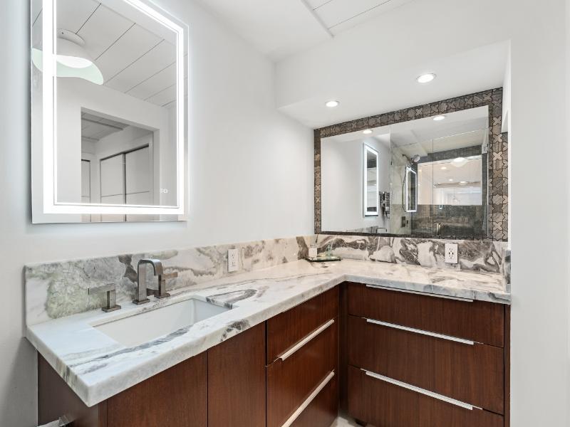 101 North Clematis Street, Unit 512 West Palm Beach, FL 33401 - Photo 9 of 17 a bathroom with a sink and a mirror