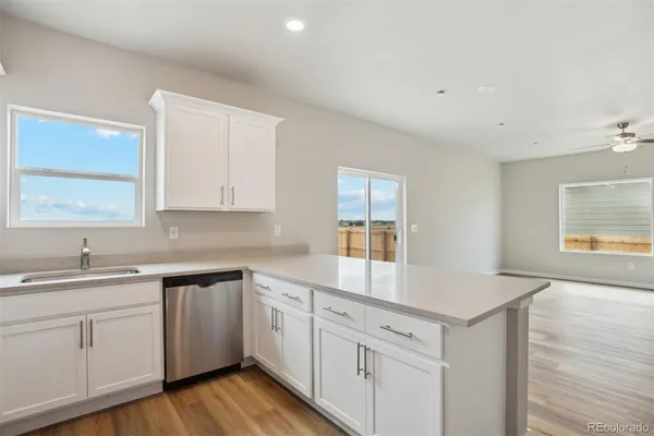 an empty room with wooden floor