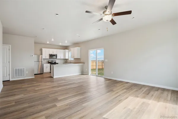a view of kitchen with wooden floor