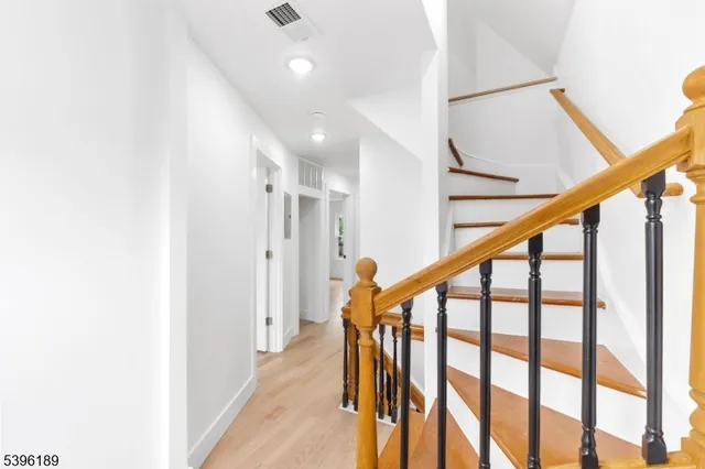 a bathroom with a toilet a sink and a window
