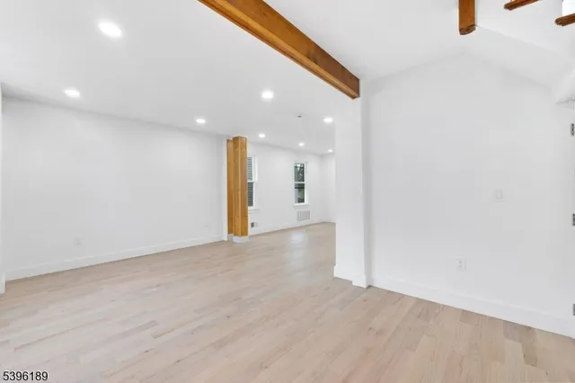 a kitchen with stainless steel appliances granite countertop a stove microwave sink and refrigerator