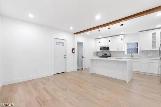 a close view of utility room with washer and dryer