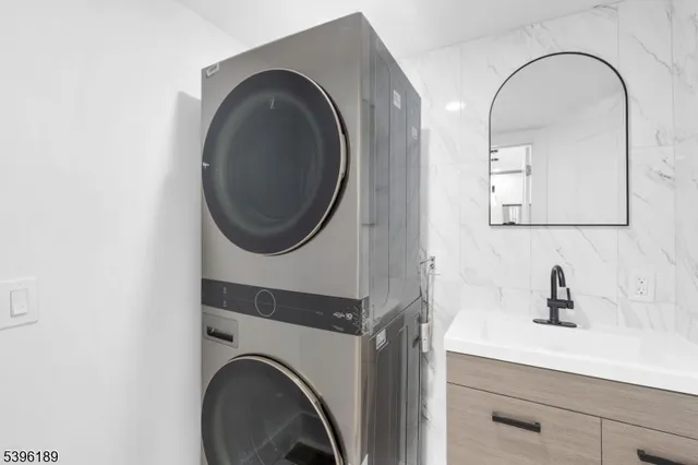 a bathroom with a sink toilet and a mirror