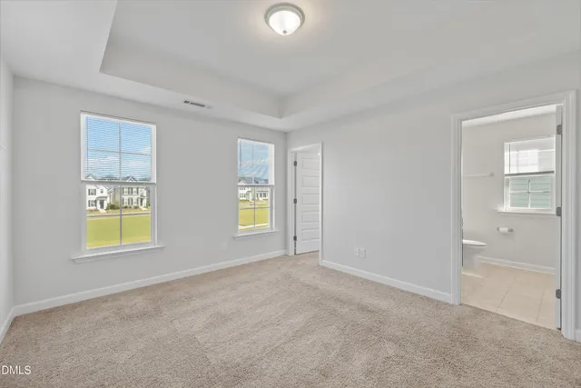 a view of an empty room and closet area