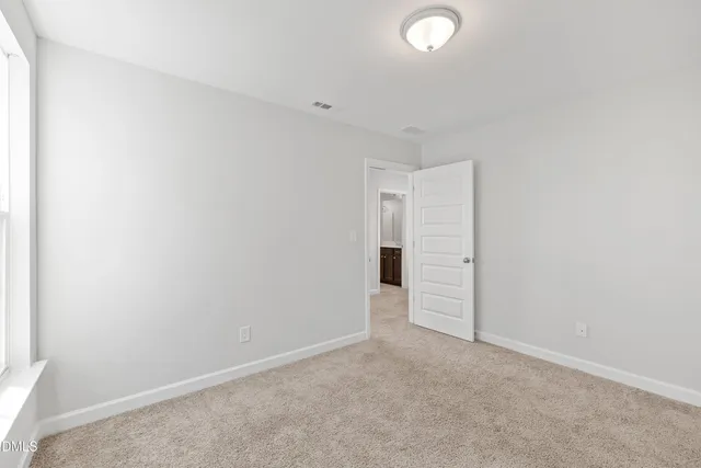 a bathroom with a sink a toilet a tub and shower